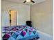 Bedroom featuring neutral walls, carpet floors, ceiling fan, and comfortable quilt at 1225 N 36Th St # 1054, Phoenix, AZ 85008