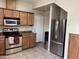 Kitchen featuring stainless steel appliances, plenty of counter space, and ample cabinet storage at 1225 N 36Th St # 1054, Phoenix, AZ 85008