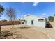 Backyard showcasing a spacious area with neutral-colored gravel and fenced perimeter at 12325 W Charter Oak Rd, El Mirage, AZ 85335