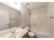 Bright bathroom featuring a single vanity, framed mirror and shower-tub combination at 12325 W Charter Oak Rd, El Mirage, AZ 85335