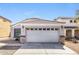 Charming single story home featuring a two-car garage and neutral color palette at 12325 W Charter Oak Rd, El Mirage, AZ 85335