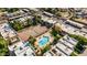 Aerial community shot featuring a pool and tennis court complex among multiple residential buildings at 1328 S Mckemy St, Tempe, AZ 85281