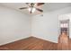 Wood floor bedroom has a ceiling fan and leads to an outdoor patio at 1328 S Mckemy St, Tempe, AZ 85281