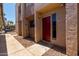 Charming townhouse exterior featuring a red front door and modern design elements at 1328 S Mckemy St, Tempe, AZ 85281