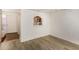 Bright living room with modern flooring, fresh white walls, and an open archway to the kitchen at 1328 S Mckemy St, Tempe, AZ 85281