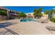 Community pool surrounded by lounge chairs and well-maintained landscaping, perfect for summer relaxation at 1328 S Mckemy St, Tempe, AZ 85281