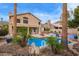 Inviting backyard with a sparkling pool, desert landscaping, patio area, and clear sky at 1333 E Rockledge Rd, Phoenix, AZ 85048