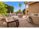 Spacious backyard features a patio, palm trees, and custom outdoor kitchen for entertaining at 1333 E Rockledge Rd, Phoenix, AZ 85048