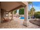 Beautiful backyard oasis with a refreshing pool, a basketball court, and an outdoor kitchen at 1333 E Rockledge Rd, Phoenix, AZ 85048