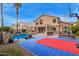 Beautiful backyard with a pool, basketball court, patio, and lush landscaping at 1333 E Rockledge Rd, Phoenix, AZ 85048