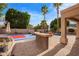 The backyard boasts a pool, basketball court, and outdoor seating, perfect for relaxation and recreation at 1333 E Rockledge Rd, Phoenix, AZ 85048