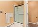 Bathroom features a glass-enclosed shower and convenient towel rack, ensuring a comfortable and functional space at 1333 E Rockledge Rd, Phoenix, AZ 85048