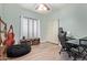 Well-lit room showcasing wood floors, a window bench, and a cozy corner workspace at 1333 E Rockledge Rd, Phoenix, AZ 85048