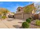 Two-story home with tile roof, three-car garage, desert landscaping, and manicured shrubs at 1333 E Rockledge Rd, Phoenix, AZ 85048