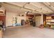 Spacious garage interior with ample storage, a workbench, and various organizational systems at 1333 E Rockledge Rd, Phoenix, AZ 85048