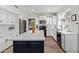 Contemporary kitchen with stainless appliances, a central island, and white cabinets at 1333 E Rockledge Rd, Phoenix, AZ 85048