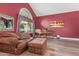 Inviting living room with piano and a comfortable sofa, bathed in natural light at 1333 E Rockledge Rd, Phoenix, AZ 85048