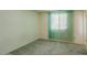 Bedroom showcasing a window with blinds, carpet flooring, and neutral walls at 13425 N 16Th Ave, Phoenix, AZ 85029