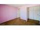 Bedroom boasting closet space, carpet flooring and pink walls at 13425 N 16Th Ave, Phoenix, AZ 85029