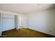 Bedroom highlighting carpet flooring, closet space, and neutral colored walls at 13425 N 16Th Ave, Phoenix, AZ 85029