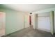 Bedroom featuring closet space, carpet flooring, a doorway to an adjacent room at 13425 N 16Th Ave, Phoenix, AZ 85029