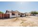 Side view of a well-maintained home with desert landscaping, privacy fence, and mountain backdrop at 13425 N 16Th Ave, Phoenix, AZ 85029