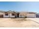 Charming single-story home featuring desert landscaping, a two-car garage, and a welcoming entrance at 13425 N 16Th Ave, Phoenix, AZ 85029