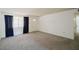 Inviting living area with plush carpet, natural light and a view of the front yard at 13425 N 16Th Ave, Phoenix, AZ 85029