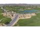 Aerial view of golf course community featuring greens, ponds, and cart paths at 1357 E Elysian Pass, Queen Creek, AZ 85140