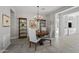 Traditional dining room with a chandelier, wood table and decorative shelving at 1357 E Elysian Pass, Queen Creek, AZ 85140