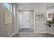 Bright entryway with neutral walls, decorative art, and tile flooring at 1357 E Elysian Pass, Queen Creek, AZ 85140