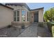 Inviting home entrance with a brick pathway and a cozy bay window at 1357 E Elysian Pass, Queen Creek, AZ 85140