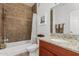 Cozy bathroom featuring a tub with tile surround and granite vanity top at 13700 N Fountain Hills Blvd # 327, Fountain Hills, AZ 85268