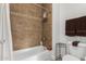 Cozy bathroom featuring tiled shower with tub, neutral brown accents, and a functional layout at 13700 N Fountain Hills Blvd # 327, Fountain Hills, AZ 85268