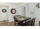 Inviting dining area with a square table, four chairs, and a decorative mirror at 13700 N Fountain Hills Blvd # 327, Fountain Hills, AZ 85268