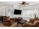 Comfortable living room featuring a ceiling fan, large window, and plush seating at 13700 N Fountain Hills Blvd # 327, Fountain Hills, AZ 85268