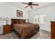 Relaxing main bedroom with neutral decor, ceiling fan, and a comfortable king-size bed at 13700 N Fountain Hills Blvd # 327, Fountain Hills, AZ 85268