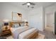Cozy bedroom featuring neutral tones, natural wood decor and a plush rug at 16788 W Beth Dr, Goodyear, AZ 85338