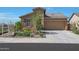 Charming single-Gathering home featuring a two-car garage and desert landscaping in a residential neighborhood at 16788 W Beth Dr, Goodyear, AZ 85338