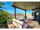 Inviting covered patio features comfortable seating and a relaxing outdoor living space at 16788 W Beth Dr, Goodyear, AZ 85338