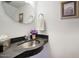 Stylish bathroom with a unique sink, modern fixtures, and a decorative mirror at 1803 E Hayward Ave # 1, Phoenix, AZ 85020