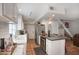 Well-lit kitchen with white cabinets, stainless steel appliances, and a functional layout at 1803 E Hayward Ave # 1, Phoenix, AZ 85020