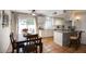 Bright and airy kitchen featuring white cabinets, stainless appliances, and an adjacent dining area at 1803 E Hayward Ave # 1, Phoenix, AZ 85020