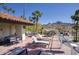 Rooftop deck area with mountain views, palm trees and featuring lounge chairs and dining tables at 1803 E Hayward Ave # 1, Phoenix, AZ 85020