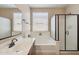 Beautiful bathroom with a tub, a stylish shower, and modern fixtures at 18430 E Azul Ct, Gold Canyon, AZ 85118