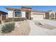 Charming single-story home with well-manicured landscaping and a two-car garage at 18430 E Azul Ct, Gold Canyon, AZ 85118