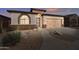 Charming single-story home with well-manicured landscaping and a two-car garage at 18430 E Azul Ct, Gold Canyon, AZ 85118