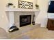 Close-up of tiled fireplace with decorative accents and tools at 18430 E Azul Ct, Gold Canyon, AZ 85118