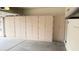 Spacious garage with ample storage provided by extensive cabinetry, creating an organized and functional area at 18430 E Azul Ct, Gold Canyon, AZ 85118