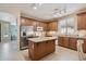 Bright kitchen features stainless steel appliances and a kitchen island at 18430 E Azul Ct, Gold Canyon, AZ 85118